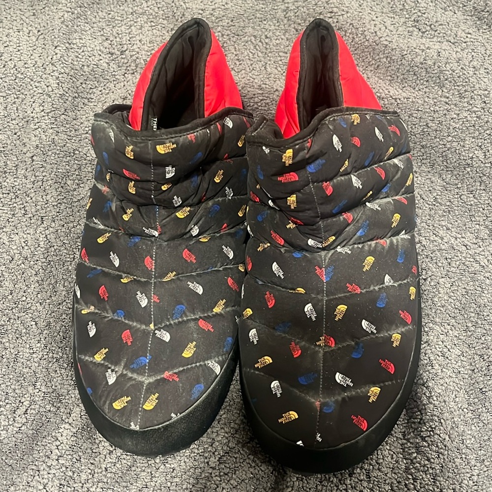 Men's The North Face slippers.
